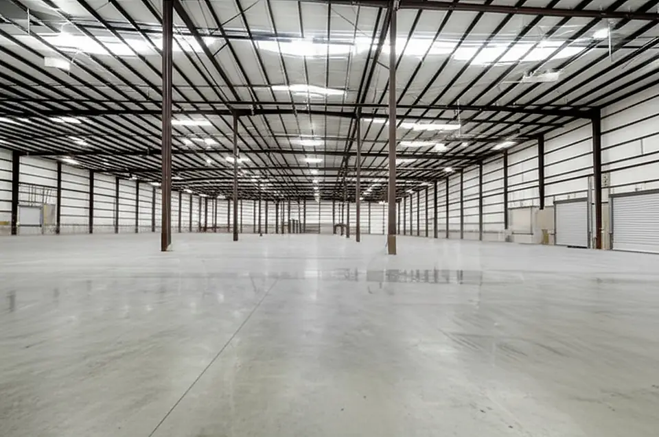 The rear warehouse at 717 Monument Street, one clear span under high ceilings
